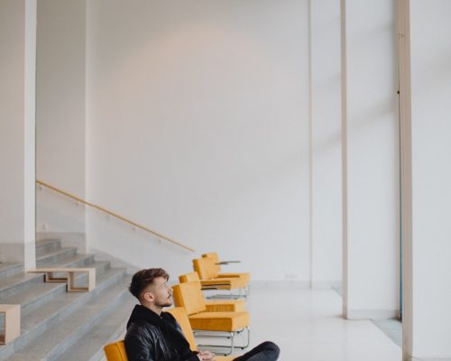 Guy waiting in an empty room Guy waiting in an empty room
