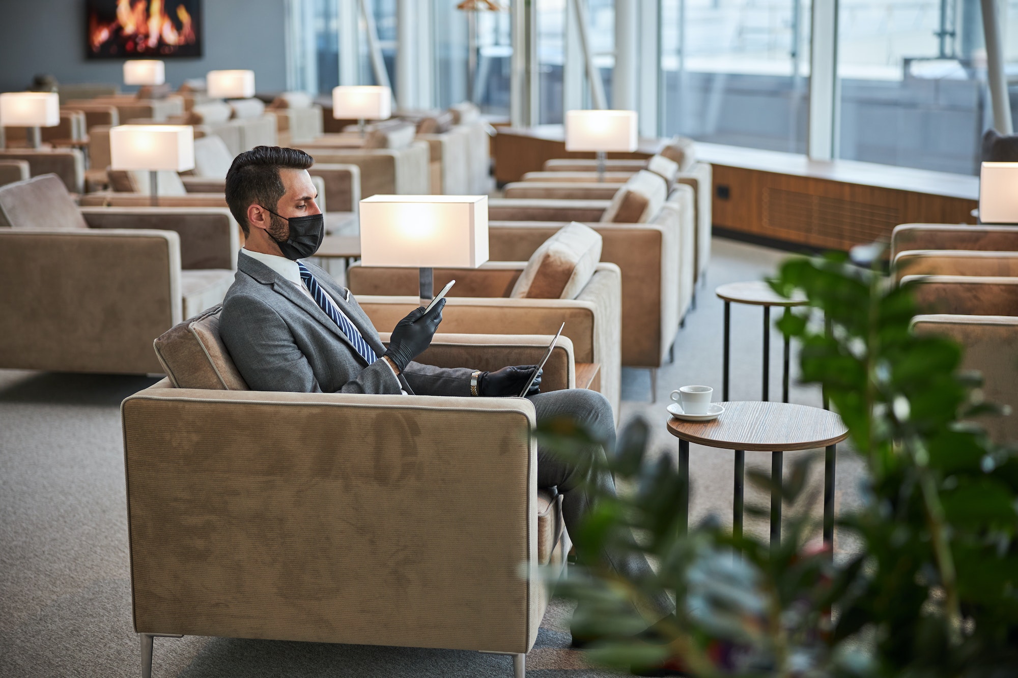 Business lounge zone with one visitor in it