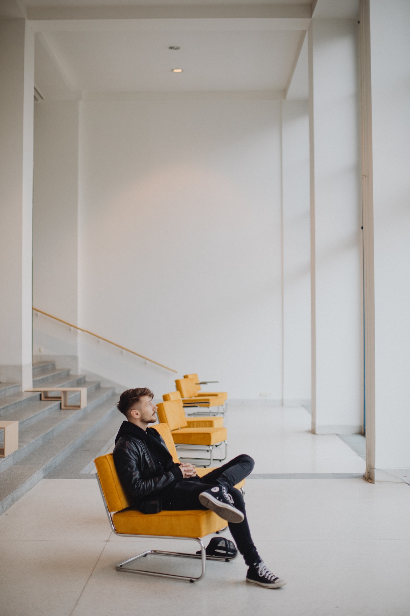 Guy waiting in an empty room